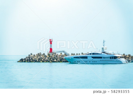 A large white yacht leaves the port. A large white yacht leaves the port. 58293355