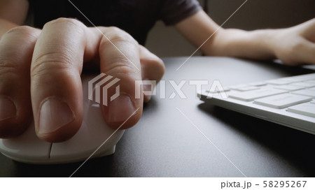 Close-up soft-focus finger typing on keyboard. Close-up soft-focus finger typing on keyboard. 58295267
