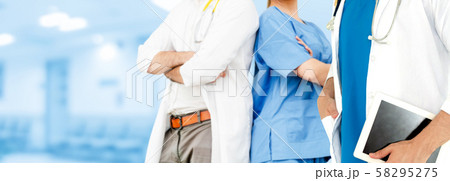 Doctor working in hospital with other doctors. 58295275