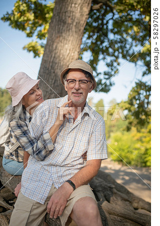 Beaming wife touching face of her handsome bearded man Beaming wife touching face of her handsome bearded man 58297026
