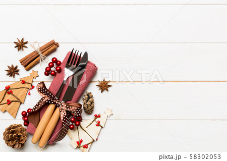 Top view of fork and knife tied up with ribbon on Top view of fork and knife tied up with ribbon on 58302053