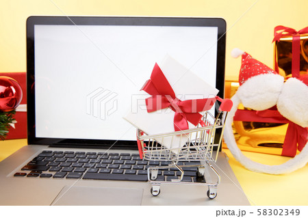 Tula, 28 09 19: shopping online concept. Credit card and laptop with christmas gifts and boxes. Tula, 28 09 19: shopping online concept. Credit card and laptop with christmas gifts and boxes. 58302349