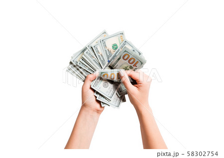 Top view of female hands counting dollar banknotes Top view of female hands counting dollar banknotes 58302754