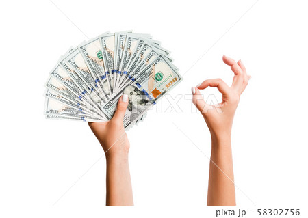 Isolated image of dollars in one hand and showing Isolated image of dollars in one hand and showing 58302756