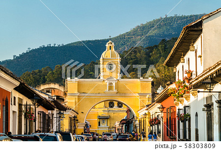 Arco de Santa Catalina and Volcan de Agua in Antigua Guatemala, Central America 58303809