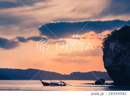 Traditional thai boat sunset beach Ao Nang Krabi 58304082