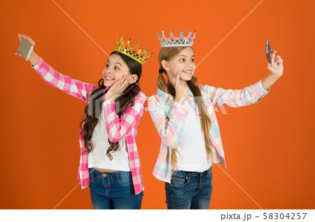 Egocentric princess. Kids wear golden crowns Egocentric princess. Kids wear golden crowns 58304257