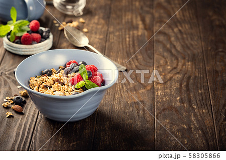 Oat granola with berries and yoghurt 58305866