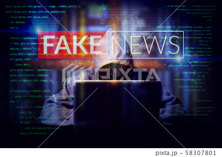 hacker working on a computer laptop, double exposure with screen of fake news. manipulated content on internet . anonymous face 58307801