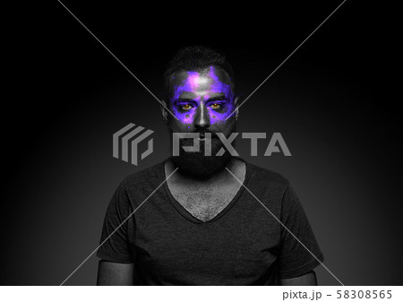 Close up portrait of young man isolated on black studio background 58308565