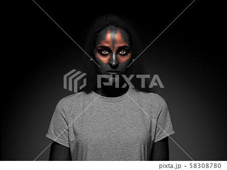 Close up portrait of young woman isolated on black studio background Close up portrait of young woman isolated on black studio background 58308780
