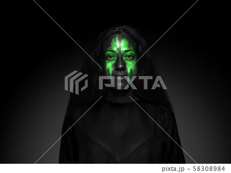 Close up portrait of young woman isolated on black studio background 58308984