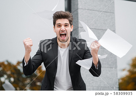 Angry furious office worker throwing crumpled paper, nervous breakdown at work 58309935