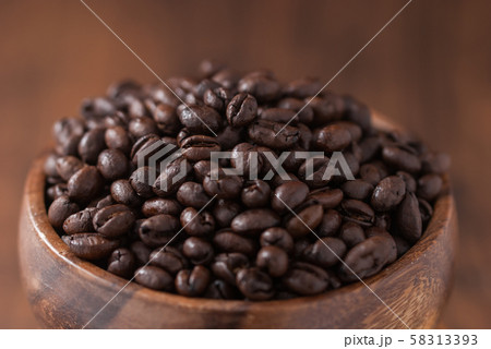 coffee beans. Black fresh roasted coffee beans.Peaberry coffee beans are a unique coffee bean that have a much richer flavor. coffee beans. Black fresh roasted coffee beans.Peaberry coffee beans are a unique coffee bean that have a much richer flavor. 58313393