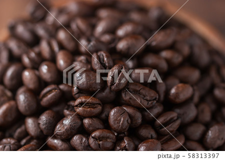 coffee beans. Black fresh roasted coffee beans.Peaberry coffee beans are a unique coffee bean that have a much richer flavor. coffee beans. Black fresh roasted coffee beans.Peaberry coffee beans are a unique coffee bean that have a much richer flavor. 58313397