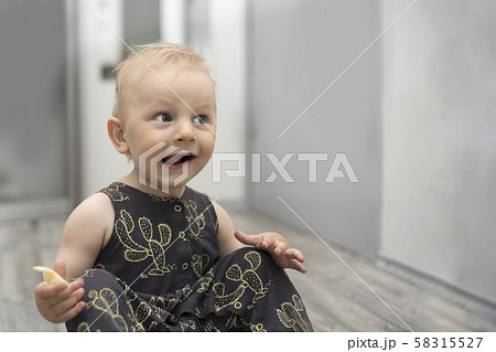 Surprised Little Baby on Floor in Home Interior 58315527