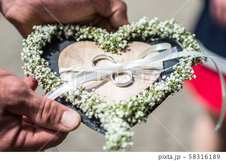 Beautiful wedding rings lie on stone surface against the stone background for a wedding couple with 58316189