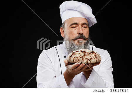 Bearded Baker Holding Fresh Bread Bearded Baker Holding Fresh Bread 58317314