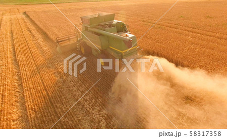 Combine harvester in action. Combine harvester in action. 58317358