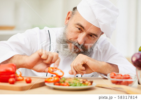 Chef Plating Dish in Restaurant Chef Plating Dish in Restaurant 58317814