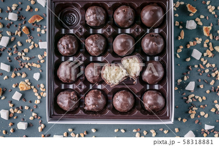 Handmade chocolates with coconut and honey. Gourmet Chocolate in a Gift Box. Top view 58318881