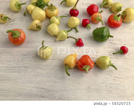 colorful fresh peppers on a wooden table colorful fresh peppers on a wooden table 58320715