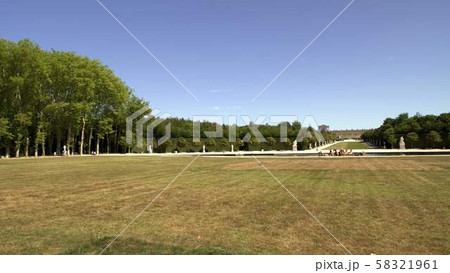 Pan shot of palace in gardens of Versailles in France during spring time 58321961