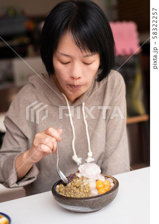 Asian woman eat shaved ice 58322257