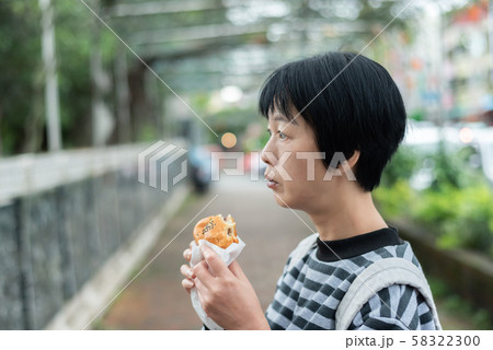 woman eat traditional Taiwanese snack woman eat traditional Taiwanese snack 58322300