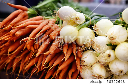 Fresh healthy organic carrots and onion on New York farmer agricultural market Fresh healthy organic carrots and onion on New York farmer agricultural market 58322648