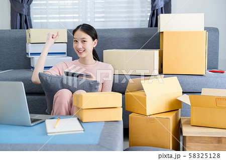 Excited asian young entrepreneur waving fists, got Excited asian young entrepreneur waving fists, got 58325128