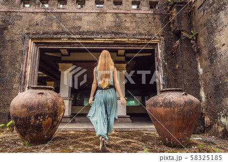 Woman tourist in abandoned and mysterious hotel in Bedugul. Indonesia, Bali Island. Bali Travel Woman tourist in abandoned and mysterious hotel in Bedugul. Indonesia, Bali Island. Bali Travel 58325185