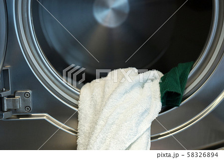Single life concept, washing machines at laundromat 171 58326894
