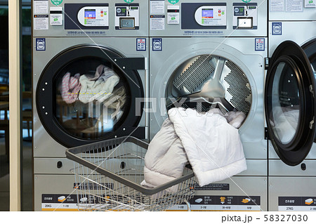 Single life concept, washing machines at laundromat 114 Single life concept, washing machines at laundromat 114 58327030