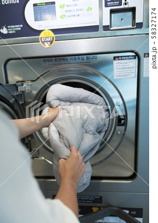 Single life concept, washing machines at laundromat 062 58327174