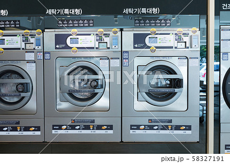 Single life concept, washing machines at laundromat 052 Single life concept, washing machines at laundromat 052 58327191