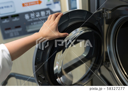 Single life concept, washing machines at laundromat 015 Single life concept, washing machines at laundromat 015 58327277