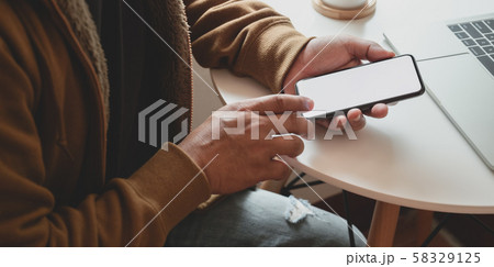 Close-up view of man holding blank screen Close-up view of man holding blank screen 58329125