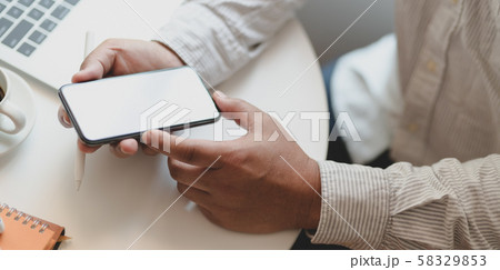Businessman working on his project while using Businessman working on his project while using 58329853