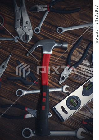 Close up tools on a wooden background. 58335957