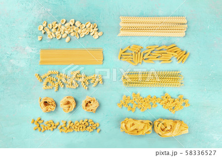 Italian pasta, flat lay banner, shot from the top on a teal blue background 58336527