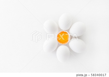 fresh white eggs with yolk on white background, flat lay 58340017