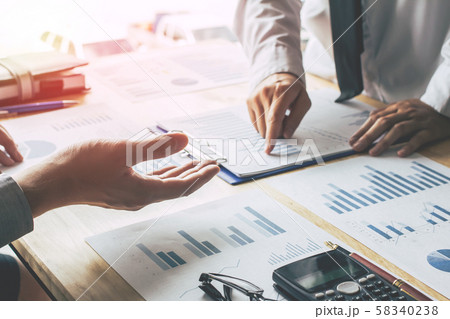Business people meeting point to discuss, plan and chart the rise and fall of economic. 58340238