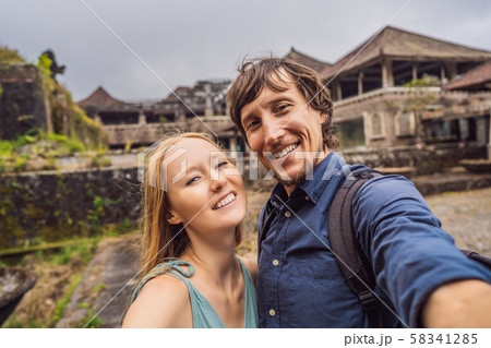 Happy couple in love in abandoned and mysterious hotel in Bedugul. Indonesia, Bali Island. Honeymoon Happy couple in love in abandoned and mysterious hotel in Bedugul. Indonesia, Bali Island. Honeymoon 58341285