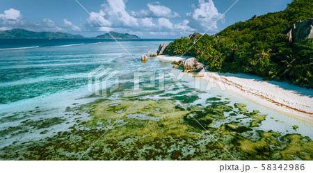 Aerial panoramic view of Anse Source d'Argent beach at La Digue island, Seychelles in the morning 58342986