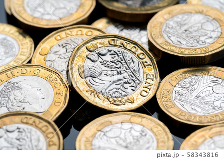 New British one pound coin in studio New British one pound coin in studio 58343816