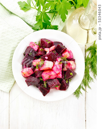 Salad of beets and potatoes in plate on board top 58346843