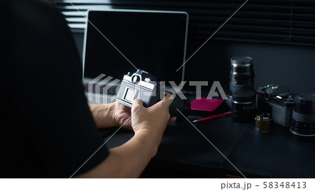 Photographer working checking camera  ,Stylish home studio concept of hipster . Seleted focus. 58348413