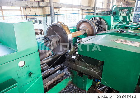 Rail wheelset in a lathe. Repair shop of railway 58348433