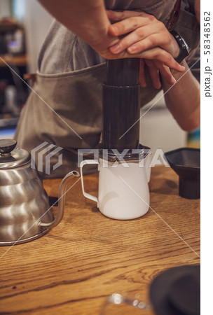 Barista is making alternative coffee with Barista is making alternative coffee with 58348562